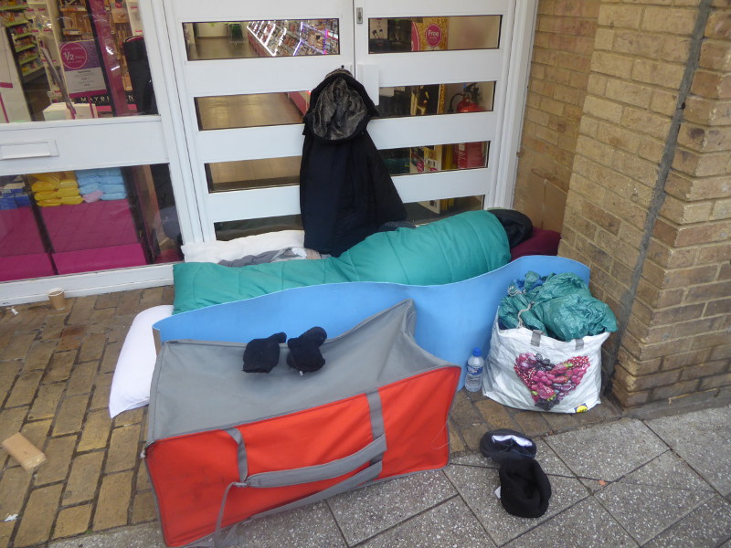3 December 2017, 9:30am: Someone in a sleeping bag in a shop doorway, 38 Fitzroy St, Cambridge, CB1 1EW