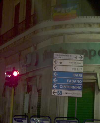 Peace flag with multi-coloured rainbow stripes, text 'PACE', in Ostuni, Puglia, Italy March 2003