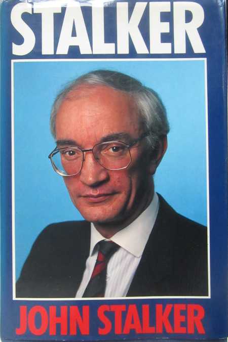 Head-and-shoulders photograph of a man wearing a jacket and tie and glasses with “STALKER” printed above it and “JOHN STALKER” below it.